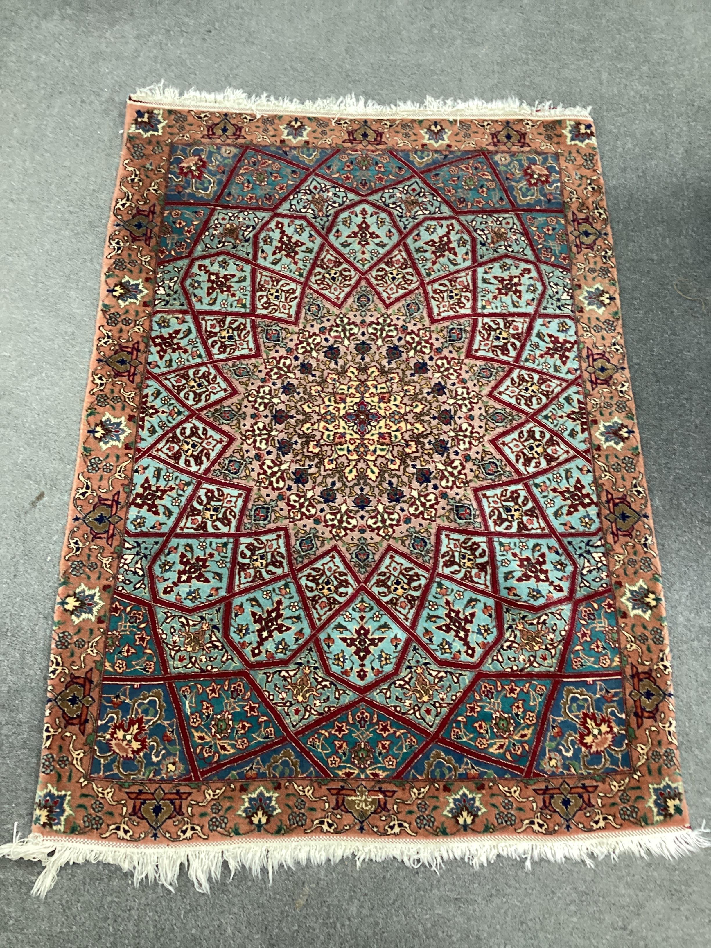 A North West Persian peach ground rug, 140 x 100cm